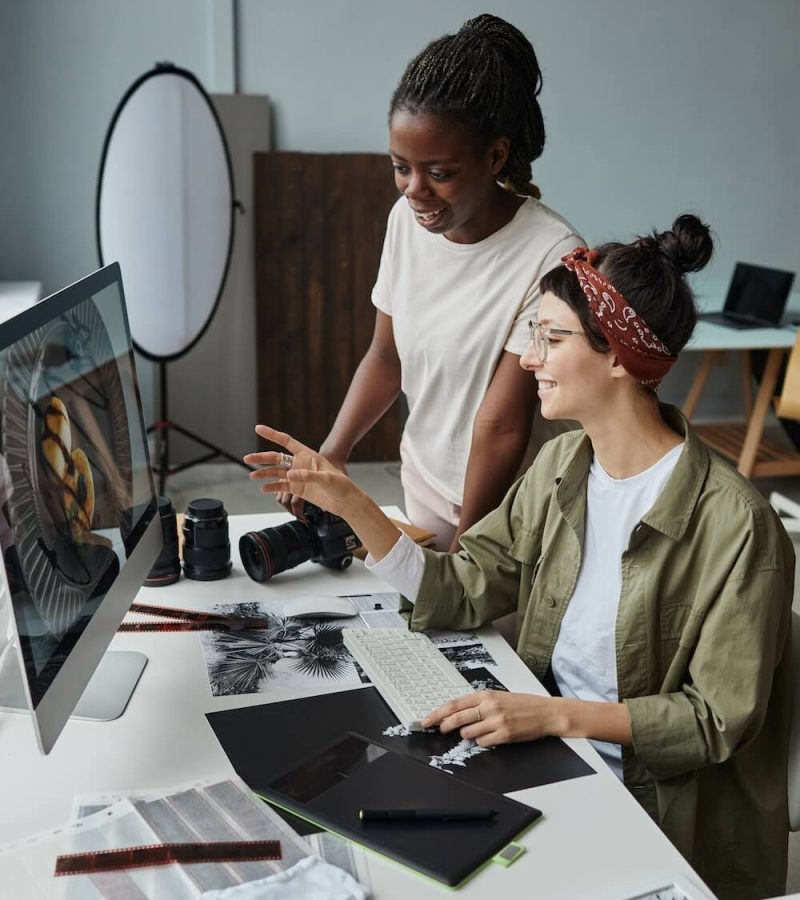 two-female-photographers-discussing-pictures-2023-11-27-05-36-57-utc (1)